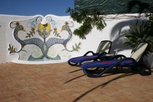 Loungers by the paddling pool